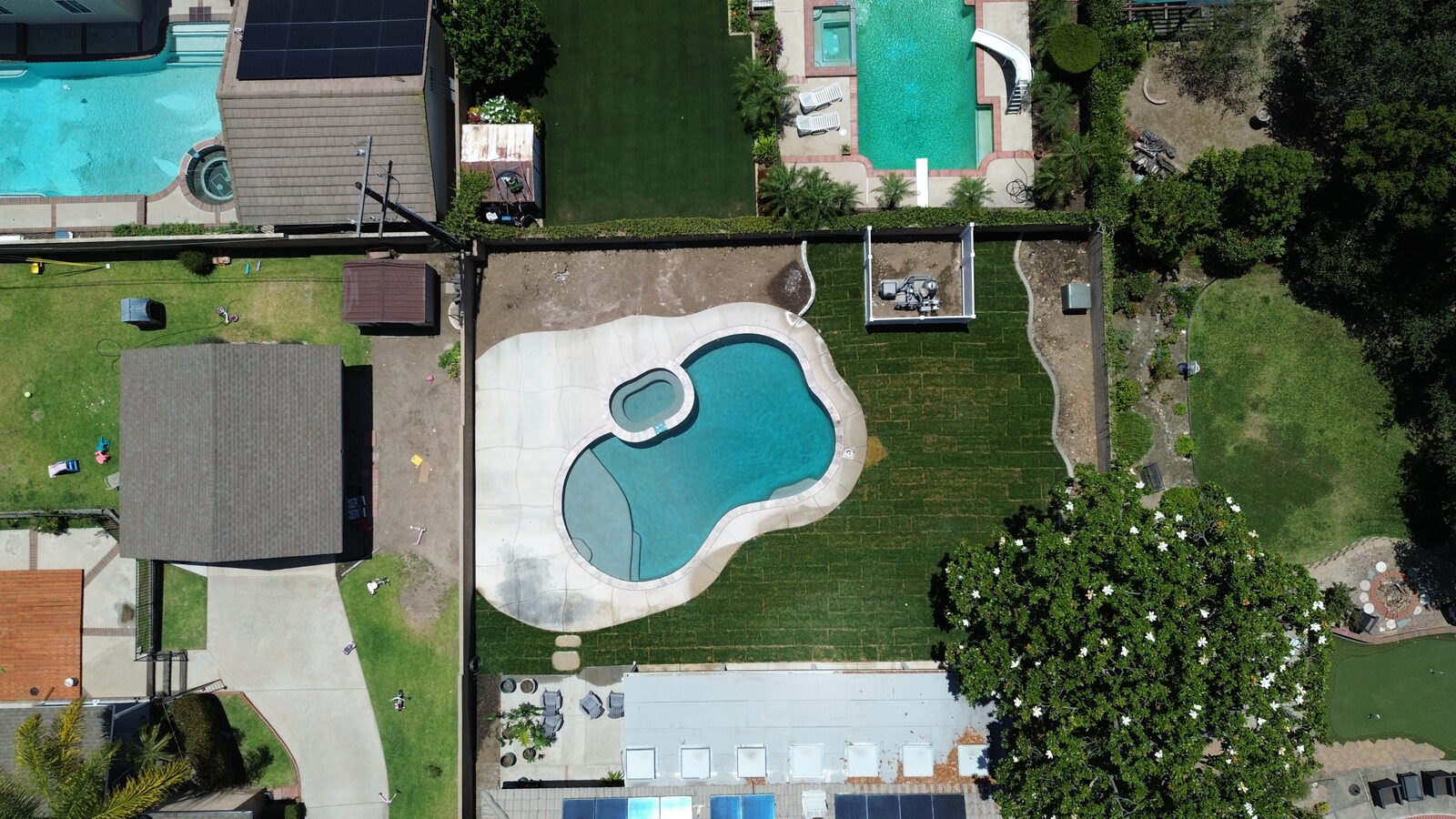 Aerial view of a complete backyard transformation by Golden Age Landscape
