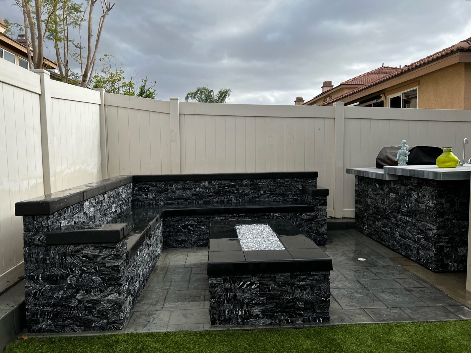 Outdoor BBQ island with built-in bench seating