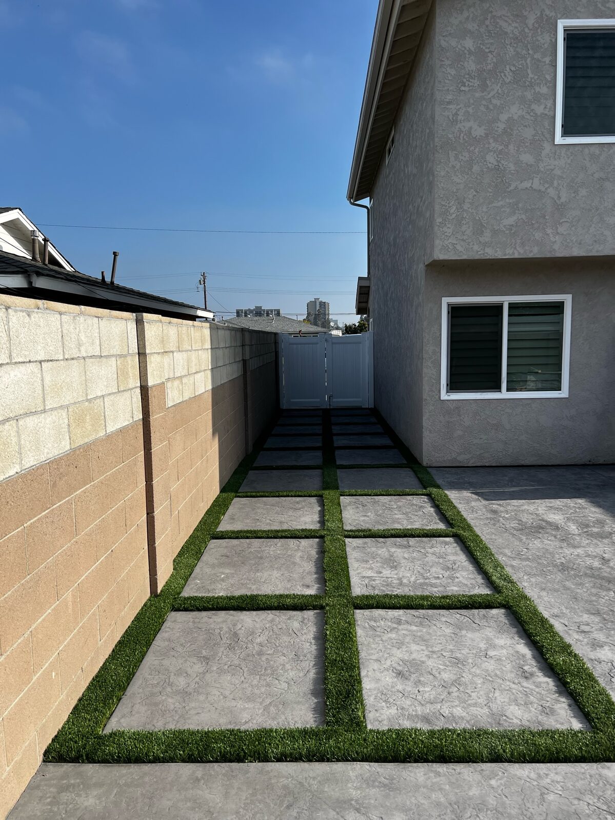Pavers with artificial turf ribbons